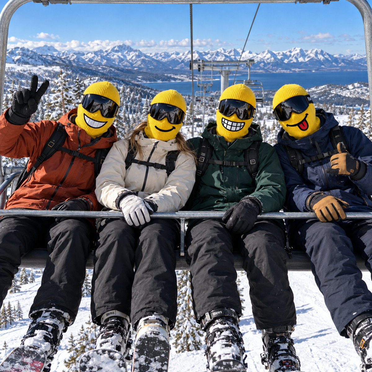 Four friends wearing different SkiYellow masks on a chairlift